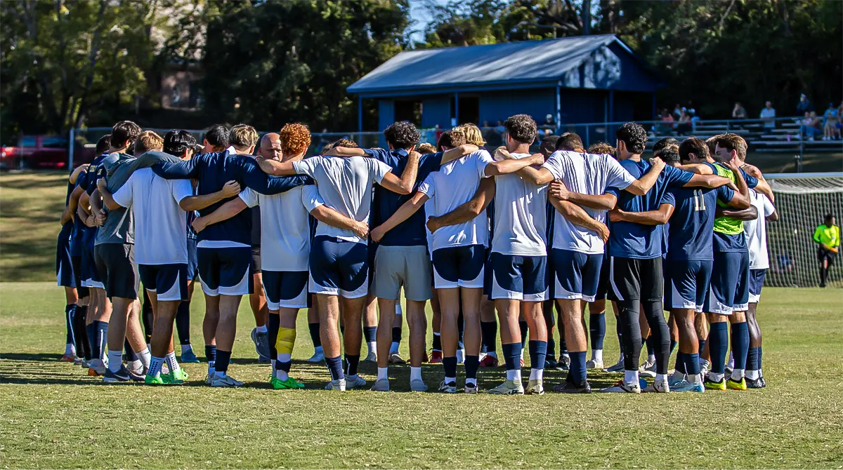 MC Men's Soccer team huddle